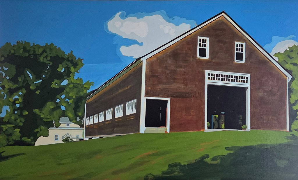 a large brown barn with white trim stands on a grassy hill under a blue sky with scattered clouds; trees and a smaller building are visible in the background.
